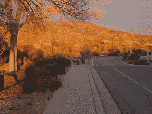 Partner and kid on a walk in the sunset as I come from down the road to meet them.