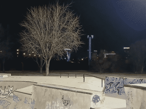 View of the brilliant Oklahoma City skyline at night, the lit up buildings towering over the skate park off Robinson