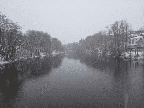Looking up the Union River in Ellsworth, the trees reflecting into the calm water and the fog of what could almost be called a blizzard making them fade in distinct layers toward the horizon
